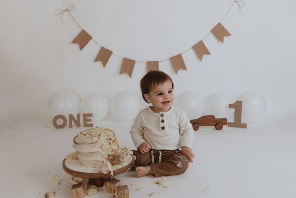 Cake smash celebrating little boys first birthday