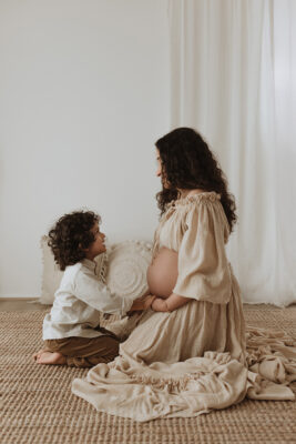 Pregnant Mama having a moment with her first born son